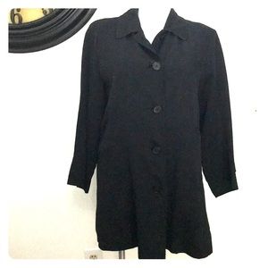 Burberry’s black button down car coat